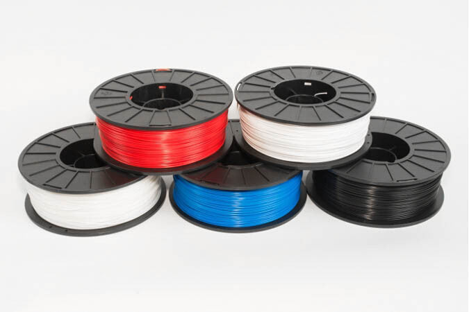 Colorful 3D printer filament spools PLA and ABS